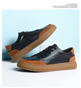 Vue détaillée de près des baskets en cuir décontractées rétro pour hommes noir et marron