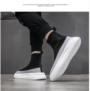 Side view of men's black fly-knit high-top sock sneakers with thick white soles