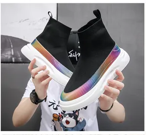 High-top black knit sock sneakers with rainbow gradient detail and white thick sole.