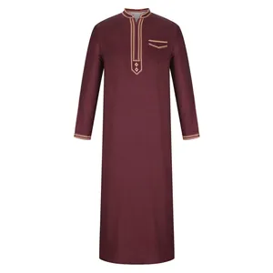 Front view of traditional burgundy men's thobe with gold ethnic embroidery details.