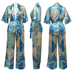Three-way view of a floral satin two-piece set with kimono top and wide-leg pants