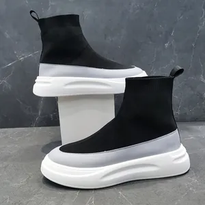 Side view of men's high-top sock sneakers with black knit upper and chunky white sole