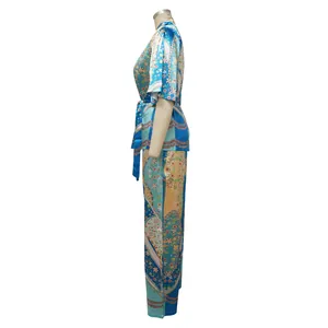 Side view of elegant two-piece floral print satin pajamas set featuring wide-leg trousers