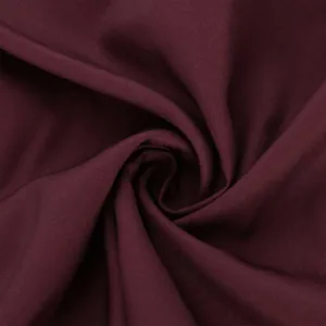 High-quality wine red fabric texture close-up for traditional men's exotic long robe