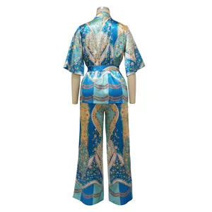 Detailed back view of a blue faux silk two-piece set with elegant floral and geometric prints.