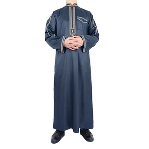 Detailed macro view of the embroidery patterns on a navy blue traditional long robe