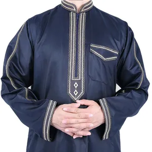 Detailed view of traditional navy blue thobe with intricate gold embroidery on the chest