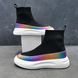 Detail of black high-top knit sock shoes with vibrant rainbow iridescent trim and thick white soles