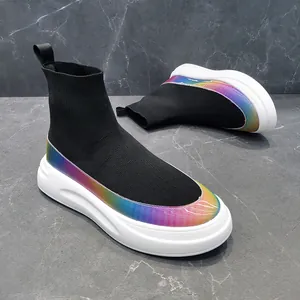 Close-up of black flyknit sock sneakers with rainbow holographic trim on thick white sole.