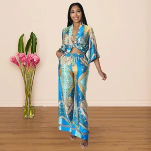 Full-body detail of women's vibrant blue printed two-piece set with tie-front top