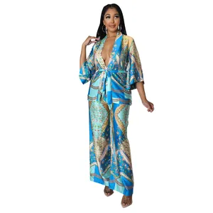 Detailed view of faux silk two-piece set featuring vibrant bohemian chain and floral prints