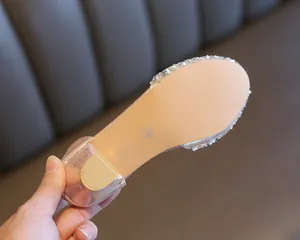 Detailed view of the durable sole and non-slip heel of girls' sparkling crystal shoes