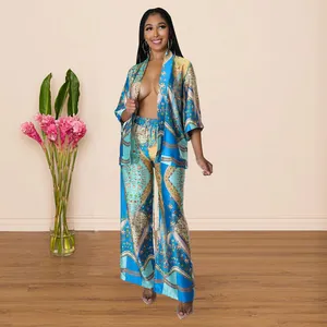 Detailed look of the luxurious floral print and silky satin texture of this two-piece set.