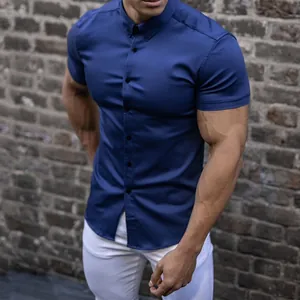 Muscle fit navy blue short sleeve shirt with elastic fabric on an athletic model
