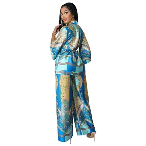 Full back view of women's blue floral satin printed two-piece wide-leg pants set.