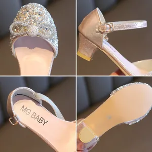 Detailed views of girls' sparkling crystal shoes with rhinestone bow and heel
