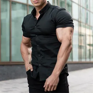 Close-up of slim fit black muscle shirt showing elastic fabric and athletic cut