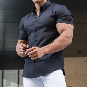 Close-up detail of a dark navy men's muscle fit short sleeve button-up stretch shirt