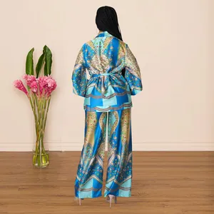 Back view of women's faux silk satin two-piece set with vintage geometric floral print
