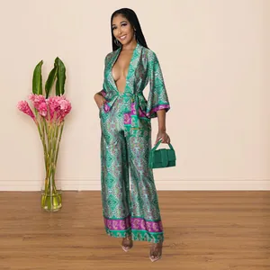 Detailed view of elegant women's green faux silk printed wide-leg pants two-piece outfit set
