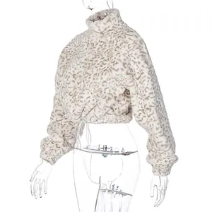 Side view of a cropped leopard print fuzzy sweatshirt displayed on a transparent mannequin.