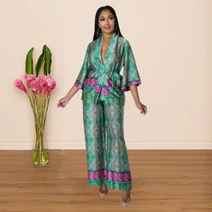 Two-piece green paisley print silky set with wrap top and wide-leg pants