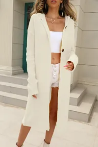 Detail view of cream knit hooded cardigan with brown wood-style buttons