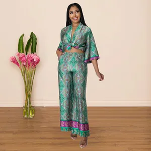 Elegant green paisley print faux silk two-piece set with tied crop top and wide-leg pants