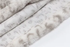 Close-up of soft leopard print faux fur fabric and interior lining texture