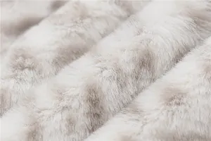 Detailed macro view of soft light beige faux fur texture for women plush hoodie