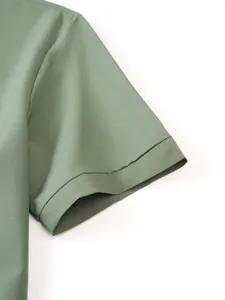 Macro view of olive green short sleeve cuff on men's premium athletic stretch shirt