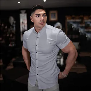 Macro detail view of a premium light grey slim fit short sleeve muscle shirt for athletic men