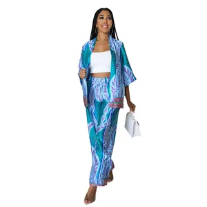 Elegant blue floral print two-piece set featuring wide-leg pants and kimono jacket.