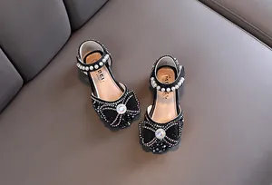 Elegant black girls' princess shoes with sparkling bow, pearls and rhinestones decoration