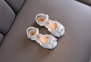 Silver girl princess shoes featuring sparkling rhinestones and elegant mesh bows