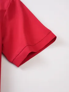 Close-up detail of a red short sleeve cuff on a men's stretch athletic fitness polo shirt