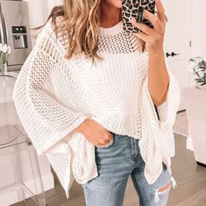 Close-up view of white hollow-out mesh knit sweater loose fit beach bikini cover-up top