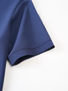 Detailed macro view of the navy blue short sleeve cuff on a premium stretch shirt