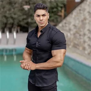 Detailed view of a premium black muscle fit short-sleeve shirt for men with stretch