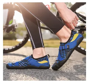 Close-up of blue and black water shoes worn during outdoor cycling activities