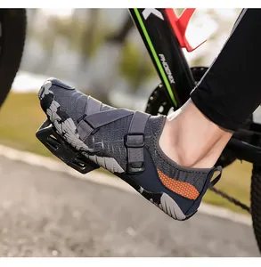 Detailed view of breathable gray outdoor water shoes on a bicycle pedal during a ride