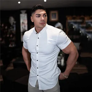 Detailed view of a white muscle fit short sleeve button-down shirt for active men