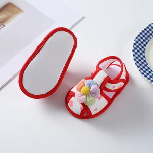 Close-up of baby girl soft sole walker shoes with colorful flower and non-slip bottom