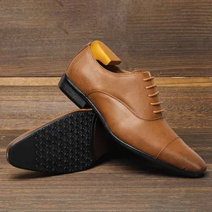Close-up of brown men's oxford dress shoes showing slip-resistant sole and wood tree