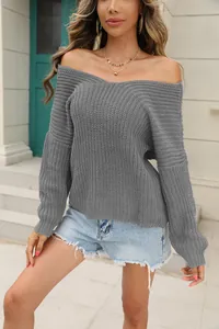 Close-up detail shot of a grey off-the-shoulder chunky knit sweater for women's fashion.