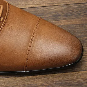Detailed close-up of retro burnished leather toe cap on men's business oxford shoes