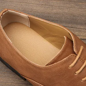 Detail view of premium brown leather oxford shoe with textured insole and lining