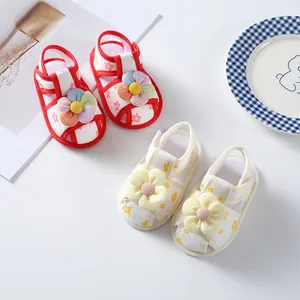 Detailed view of baby girl summer sandals with 3D flower decorations and soft soles
