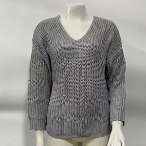 Macro view of the grey V-neck knit sweater showing detailed waffle weave texture