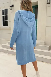 Back view of a light blue long hooded knit cardigan with textured stitch patterns.